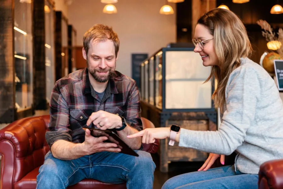 Support coordinator and participant reviewing an NDIS plan on a tablet — NDIS support coordination in Perth